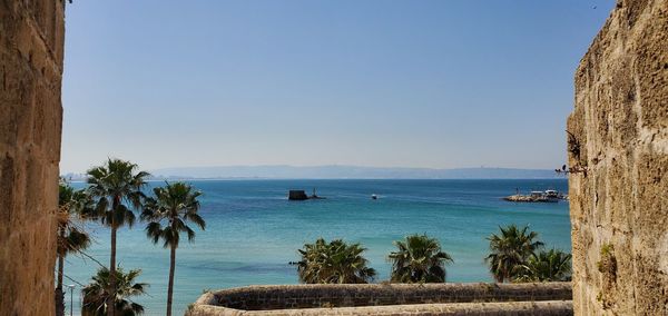 Scenic view of sea against clear blue sky