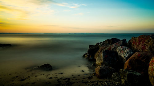 Scenic view of sea against sky during sunset