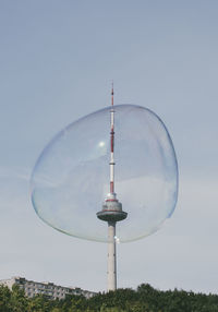 Low angle view of bubble against vilnius tv tower