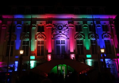 Low angle view of illuminated building at night