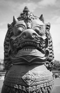 Close-up of lion statue at park