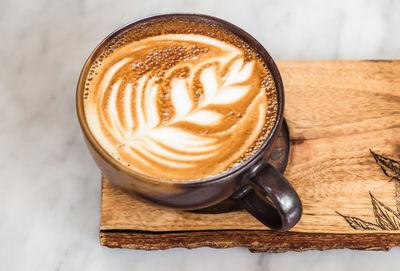 Close-up of cappuccino on table