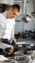 Man preparing food in kitchen