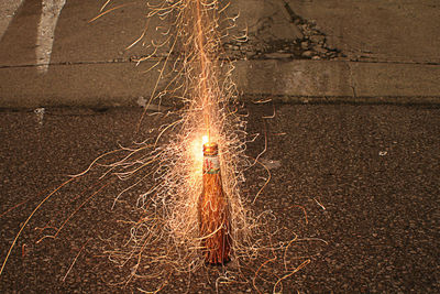 Close-up of illuminated sparkler at night