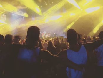 Rear view of people enjoying music concert