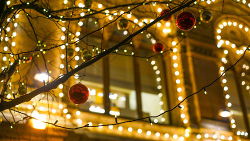Low angle view of illuminated christmas lights hanging from ceiling
