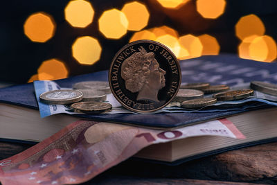 Close-up of coins on table