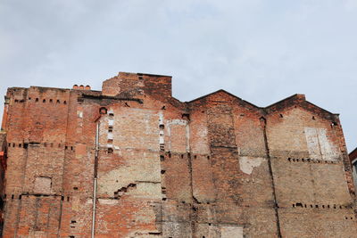 Low angle view of old building against sky