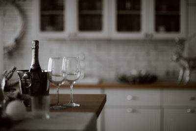 Close-up of wine glasses on table