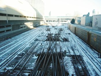 Train on railway tracks in city