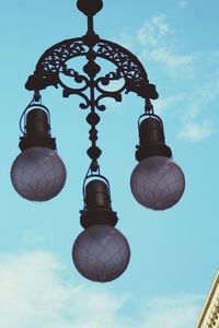 Low angle view of street light against sky