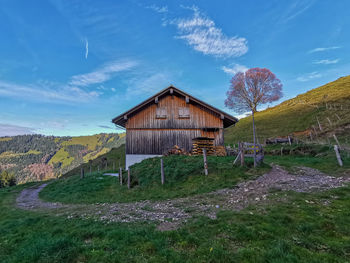 House on field against sky