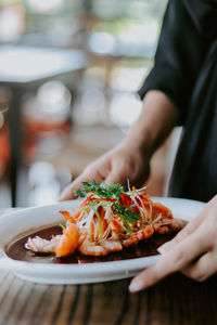 Midsection of woman having food