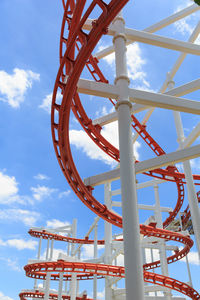 Low angle view of rollercoaster against sky