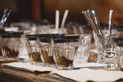 Close-up of wine glasses on table in restaurant