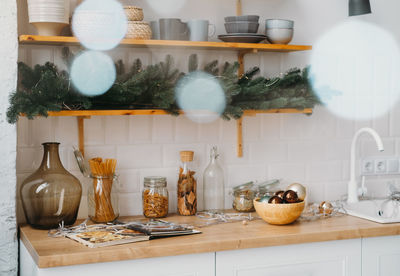 Christmas decor on the kitchen with garland. festive home interior. christmas tabletop setting over