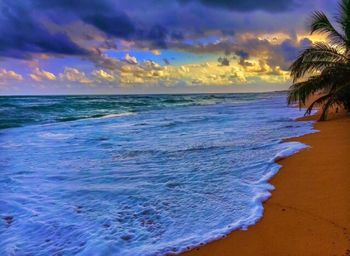 Scenic view of sea against cloudy sky