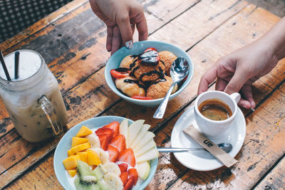 Midsection of man having breakfast