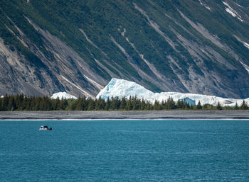 Scenic view of sea against mountain