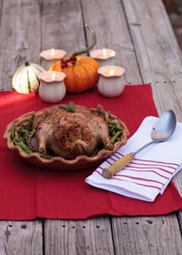 High angle view of roast chicken in container on table