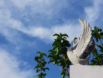 Low angle view of statue against sky
