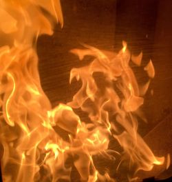 Close-up of illuminated fire in water