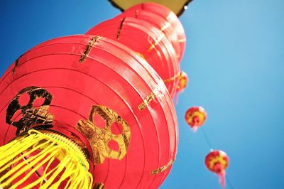 Low angle view of colorful hot air balloon against blue sky