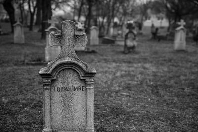 Close-up of cross in cemetery