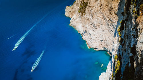 Aerial view of sea against blue sky