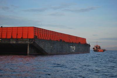 View of ship in sea against sky