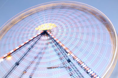 Low angle view of ferris wheel against sky