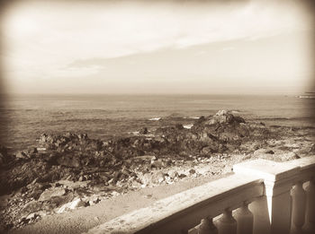 Scenic view of sea against cloudy sky