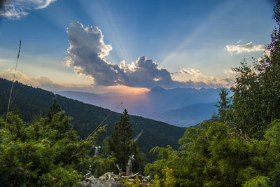 Scenic view of mountains against sky at sunset