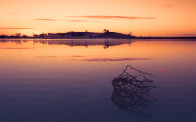 Scenic view of lake against sky during sunset