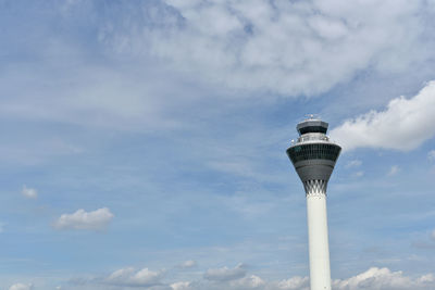 Low angle view of communications tower against sky