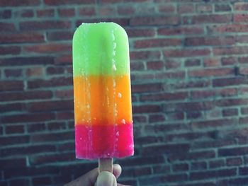 Close-up of hand holding ice cream