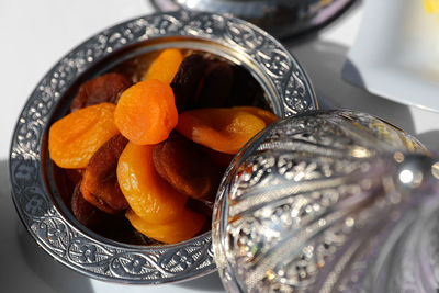 High angle view of oranges in bowl on table