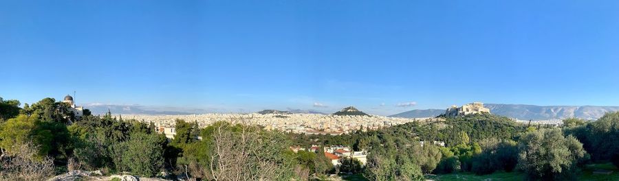 Panoramic view of landscape against blue sky