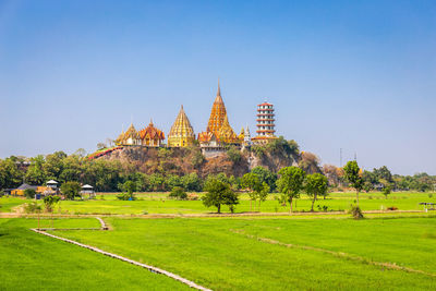 View of temple on building against sky