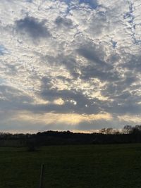 Scenic view of field against sky during sunset