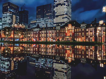 Tokyo station  reflected on the surface of the water