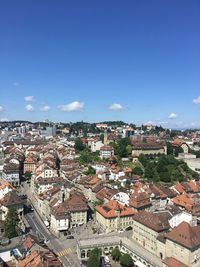 High angle view of houses in town against sky