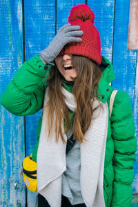 Midsection of woman wearing hat