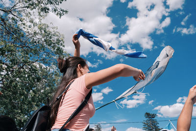 Argentinian woman with waving flag celebrating victory fifa world cup 2022 qatar