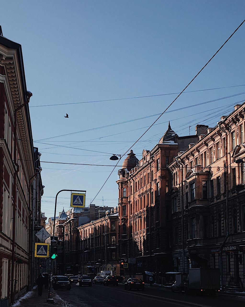 CARS ON ROAD AGAINST SKY