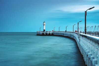 Bridge over sea against sky