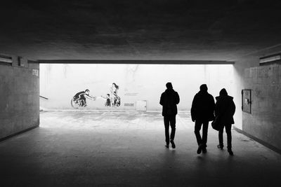 Silhouette people on bicycle