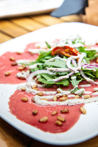 Close-up of pizza served in plate on table