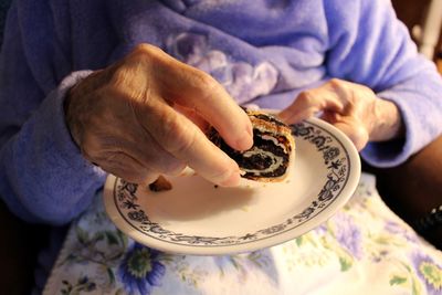 High angle view of man holding cake