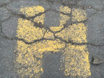 High angle view of yellow shadow on street